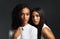 Women who stick together conquer together. Portrait of two attractive young women wearing white blouses posing closely