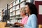 Women working on computers in library