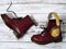 Womens accessories, footwear burgundy boots, yellow wireless headphones. Fashion outfit, shopping concept, flat lay