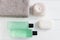 Womens beauty concept products gray towels flatlay top view