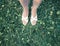 Womens feets in sandals on grass