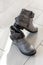 Womens gray fashion boots stay on floor, copy space