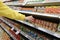 Womens hand selects the can food at the store