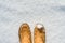 Womens legs in boots in the snow, winter is coming, hello winters, copy space at the top, top view close up