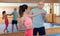 Womens self-defense workout with personal trainer, fighting training in gym