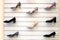 Womens shoes on shelves. Collection of shoe display in store window for sale