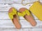 Womens shoes yellow leather sandals with knotted bow. Fashion outfit, spring summer collection. Shopping concept. Flat lay, view