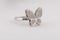 Womens silver butterfly ring with diamonds isolated on white background.
