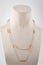 Womens silver double chain with gold inserts on white mannequin