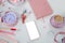 Womens stylish accessories, smartphone with blank screen, glamorous set in pink shades, flat lay, copy background, womens clothing