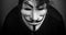 Womman wearing Vendetta mask. This mask is a well-known symbol for the online hacktivist group Anonymous