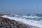 Wonderful beach with small stones in Cyprus. Kourion beach, Southern Cyprus. Blue sky amd big waves and seacost. Seacost created