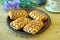 Wonderful biscuit cakes poured with chocolate stand on clay plate