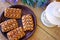 Wonderful biscuit cakes poured with chocolate stand on clay plate