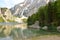 The wonderful Braies lake in the Dolomites in spring with the mountains still covered in snow