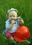 Wonderful child with a orange helmet and a wrench