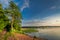 Wonderful dusk at the summer lake with dynamic clouds