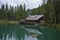 Wonderful emerald-colored lake with wooden bridge and cabin near Cortina d`Ampezzo