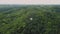 A wonderful flight to the beautiful forest near the wide river. Aerial view of pine forest in summer. Beautiful