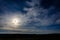 A wonderful full moon has descended over Ukrainian carpathians in blurry clouds