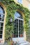 Wonderful glass doors covered around wild grapes and ivy