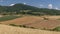 Wonderful glimpse of the Tuscan countryside near Santa Luce, Pisa, Italy, in the summer season with hay bales on the fields