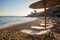 Wonderful Greece - beach : transparent water . sand and straw awnings