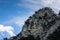 wonderful high rocky mountain with trees and sky