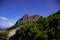 Wonderful hiking trail with conifers and the mountain `GroÃŸer Rettenstein` in the background