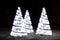 Wonderful holiday fir-tree illumination of sparkling white bokeh background