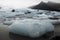 Wonderful icelandic nature landscape. High mountains, snow, mountain riwer and green grassland.