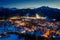 Wonderful illuminated Zakopane city in winter at night, aerial view