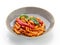 A wonderful Italian pasta dish in tomato with spinach and paprika.