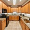 Wonderful kitchen area with honey-colored cabinetry