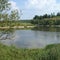 Wonderful landscape: lake, green shores, cliff