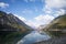 Wonderful landscape of lake plansee with reflections of trees and alps mountain