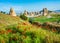 Wonderful landscape with view at fairy chimneys and with flowering poppies in Cappadocia, Anatolia, Turkey. Volcanic mountains in