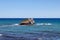 Wonderful light and dark sea, rock in the centre in Akamas peninsula national park, Cyprus. Aphrodite bath. Blue sky and sea.