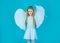 Wonderful little girl angel with white wings. Little angel Girl in white dress with angel wings on isolated background.