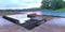 Wonderful little patio near the pool in a country villa. Wonderful view of the forest clearing. Black and white sofa and table.