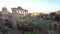 Wonderful panning at sunset in ancient Roman Forum with ruin of famous Temple and building