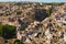 Wonderful panoramic view of ancient Ortahisar cave city. Blue sky background. Popular travel destination in Turkey.