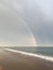 Wonderful rainbow over the sea and the beach in Turkey after heavy rain