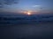 Wonderful relaxation on the evening shores of the Indian ocean, looking at the waves, colored clouds that reflect on the wet sand.