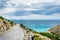 Wonderful romantic summer afternoon landscape panorama coastline Adriatic sea. A narrow mountain road above the cliffs along the c