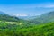 Wonderful romantic summer afternoon landscape panorama. Green, emerald valley of in the canyon plateau. Deciduous forest. Baska on