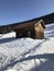 Wonderful ski landscape with wooden cottage in the mountains