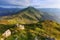 Wonderful springtime panoramic landscape in mountains at sunrise.Farcau Peak. Maramures. Romania.