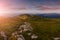 Wonderful springtime panoramic landscape in mountains at sunrise.Farcau Peak. Maramures. Romania.