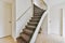 Wonderful staircase with gray carpet